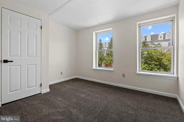 an empty room with windows