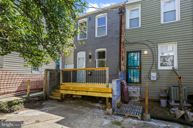 a small garden is sitting in front of a house