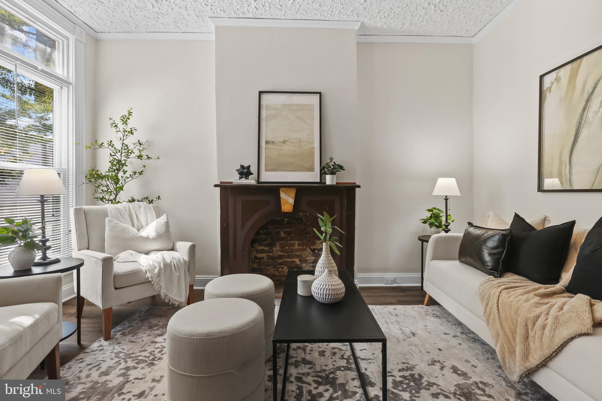 884 Washington Boulevard Baltimore, MD 21230 - Photo 7 of 35 a living room with furniture and a fireplace