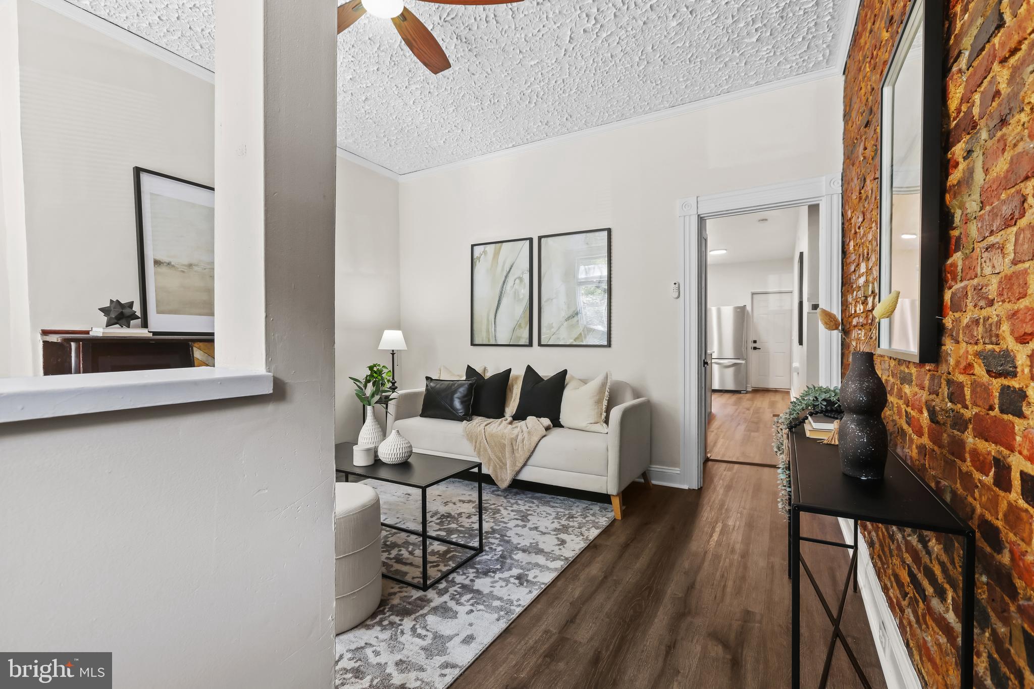 884 Washington Boulevard Baltimore, MD 21230 - Photo 9 of 35 a living room with furniture and a window