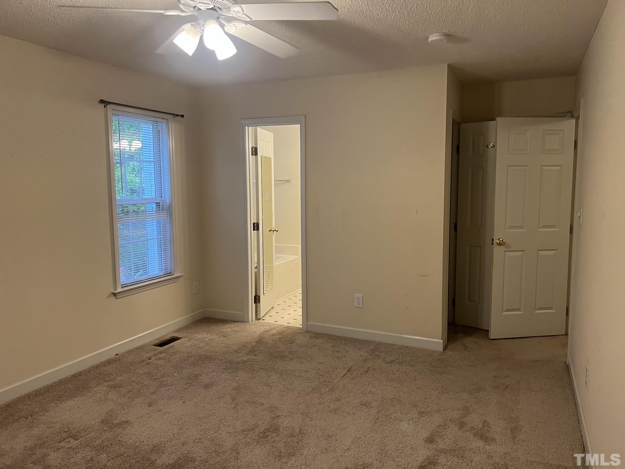 4216 Wolftrap Road Raleigh, NC 27616 - Photo 15 of 22 an empty room with windows and closet
