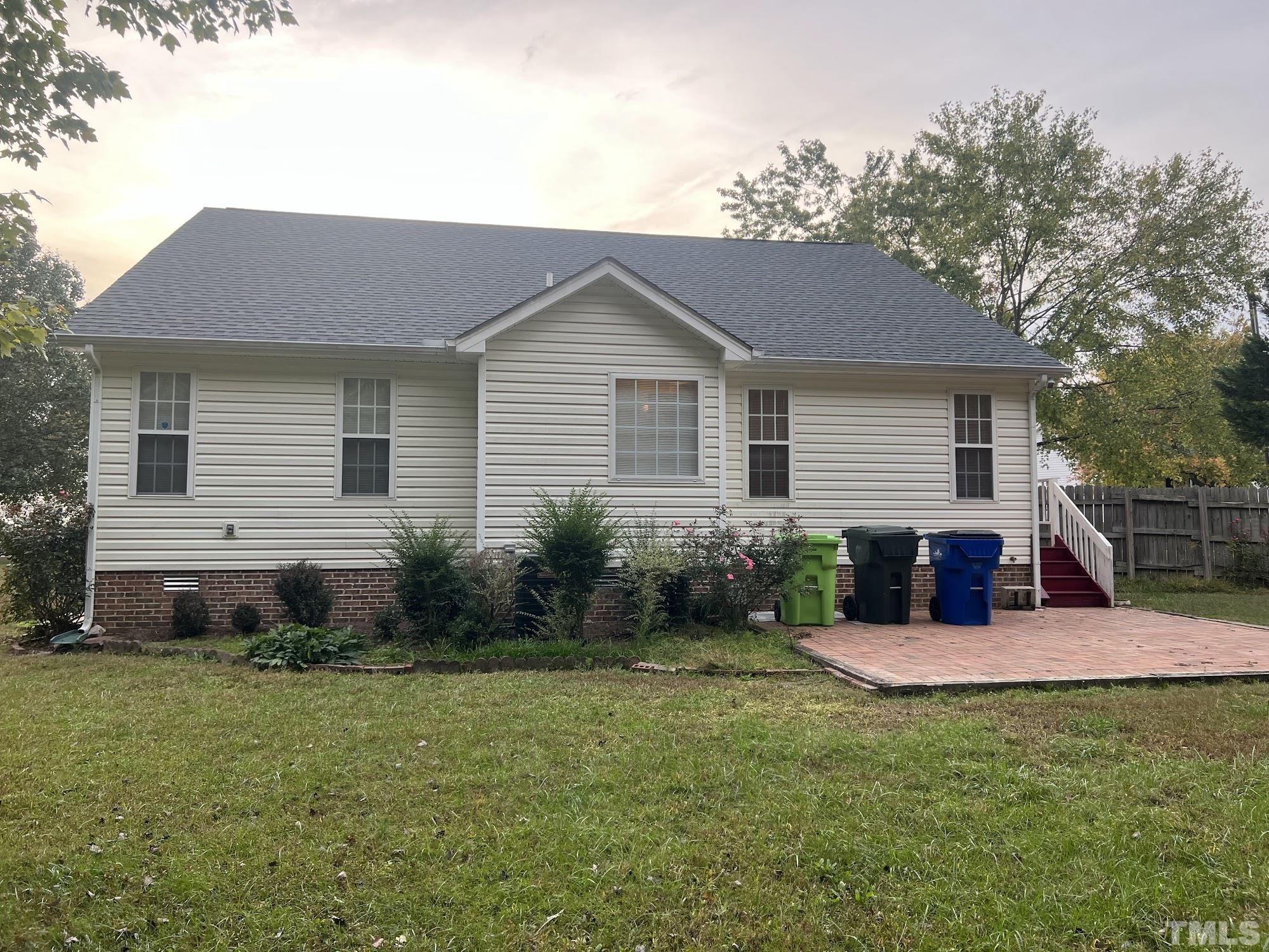 4216 Wolftrap Road Raleigh, NC 27616 - Photo 2 of 22 a view of a house with a backyard and sitting area
