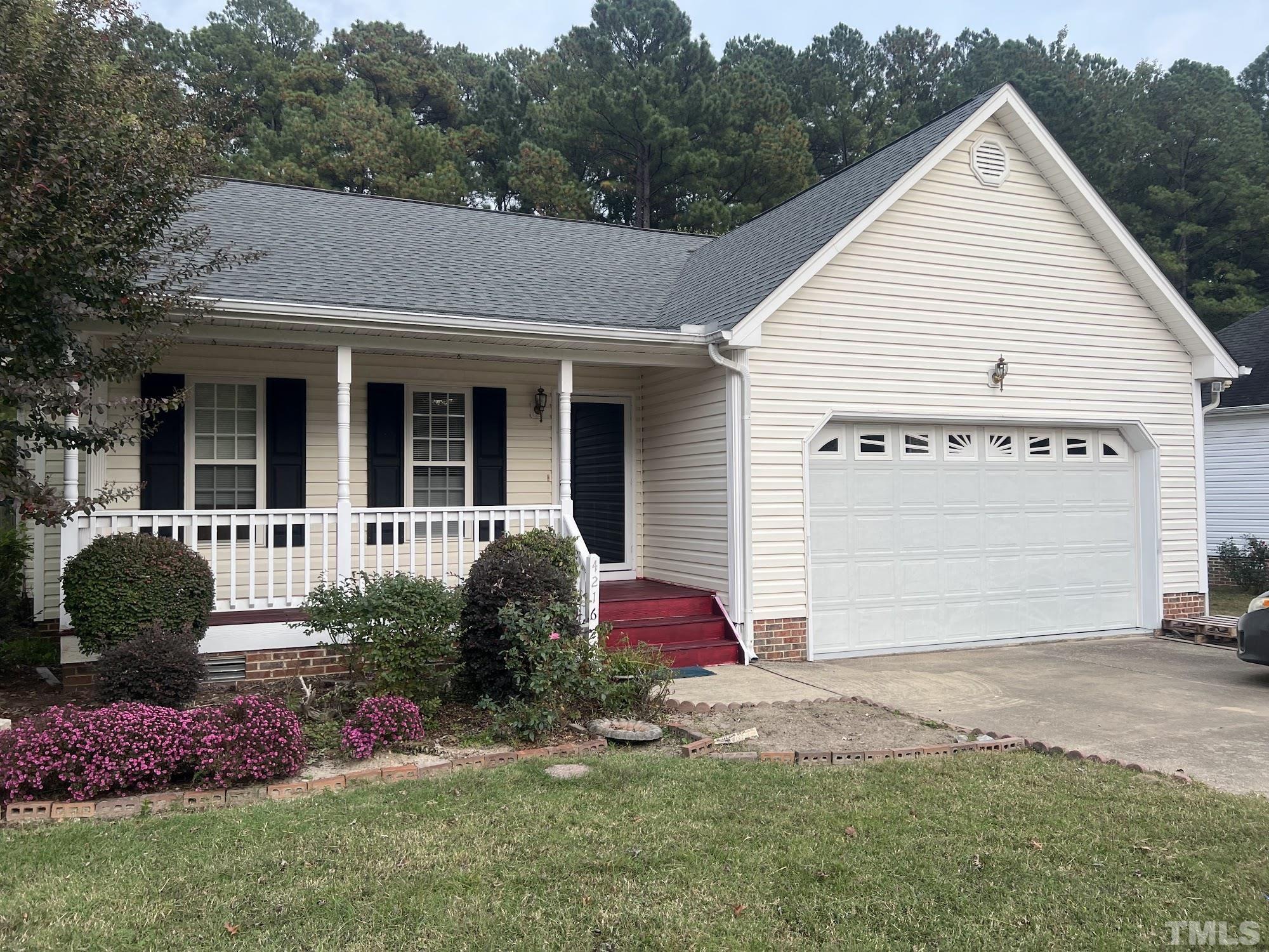4216 Wolftrap Road Raleigh, NC 27616 - Photo 22 of 22 a front view of a house with garden