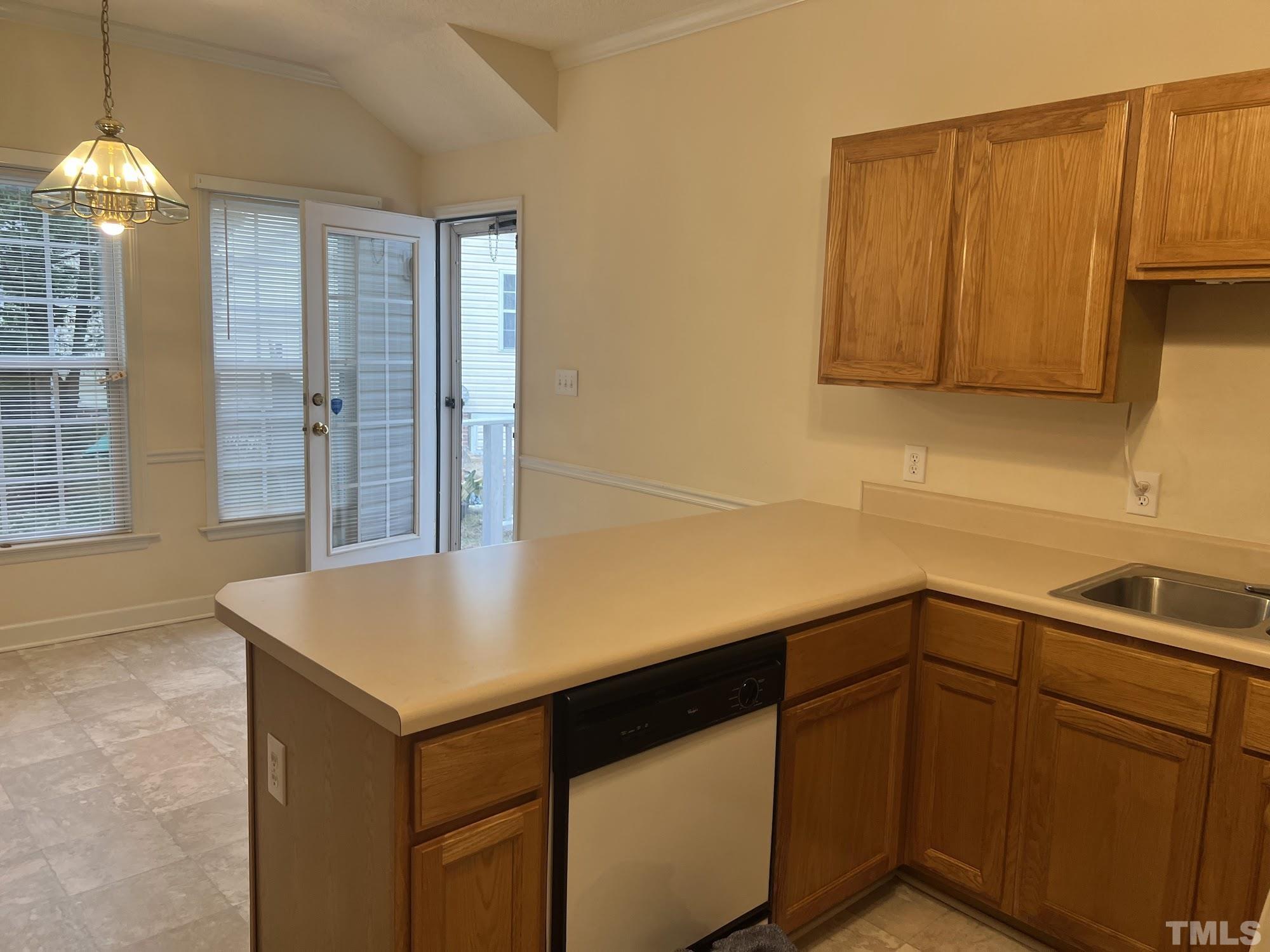 4216 Wolftrap Road Raleigh, NC 27616 - Photo 10 of 22 a kitchen with a sink and cabinets