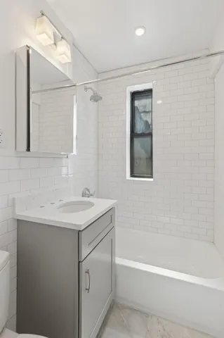 a bathroom with a sink and a bathtub