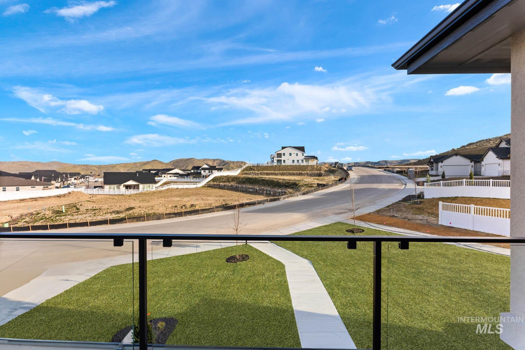 13366 North Spring Creek Way Boise, ID 83714 - Photo 28 of 44 View of yard featuring a residential view and a balcony