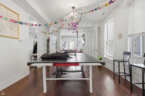 a view of a dining room with furniture and wooden floor