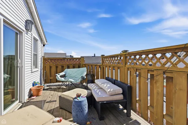 a view of a balcony with furniture