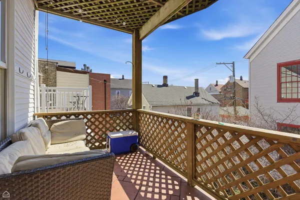 a view of balcony with furniture
