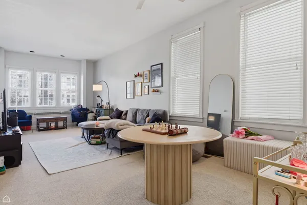 a living room with furniture and window