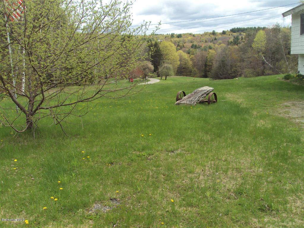 23 Upper Sargent Road Washington, MA 01223 - Photo 3 of 3 a backyard of a house with a yard and outdoor seating