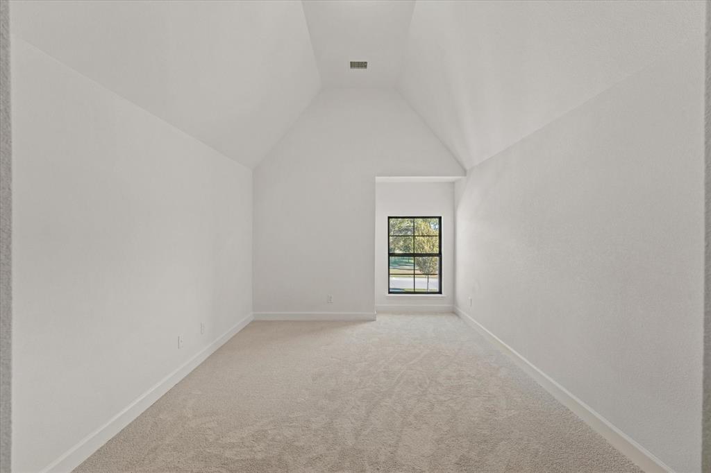 4626 Rillstone Road Midlothian, TX 76065 - Photo 30 of 40 Additional living space featuring light colored carpet and vaulted ceiling