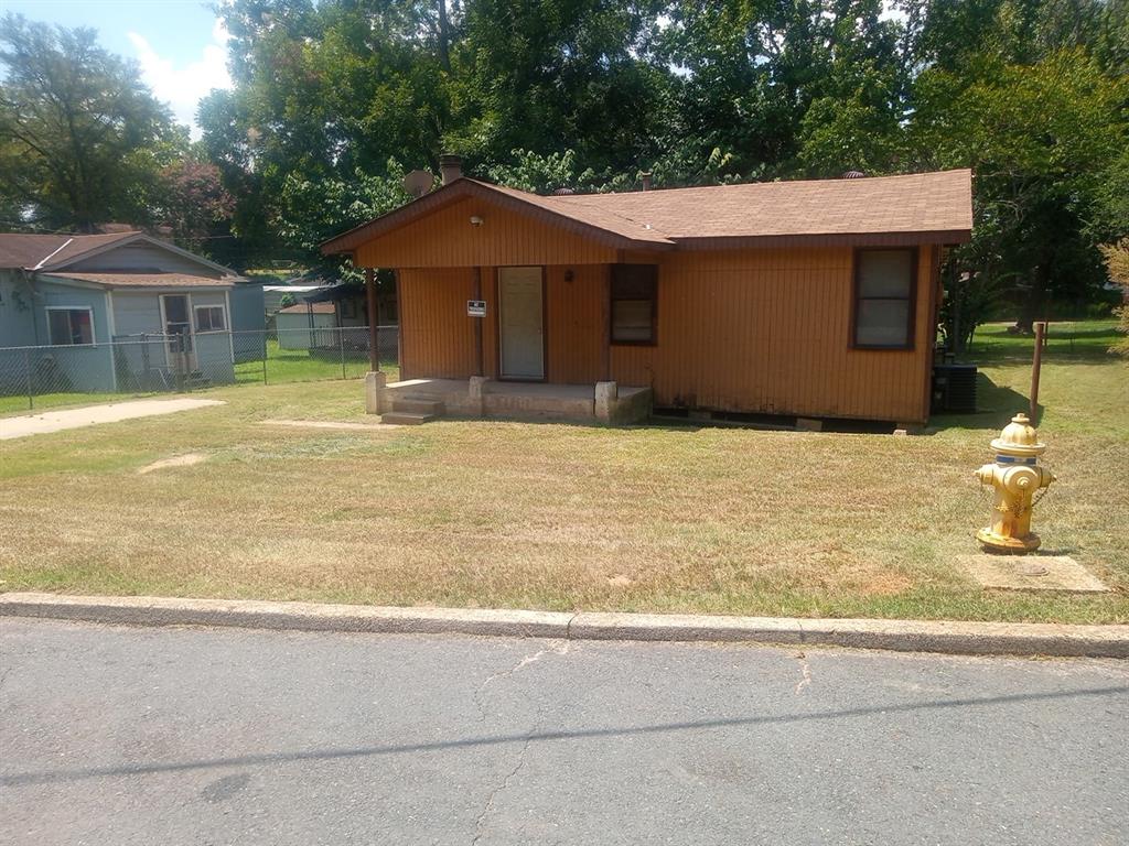 a house with trees in the background