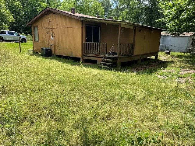 a view of a backyard with a small cabin