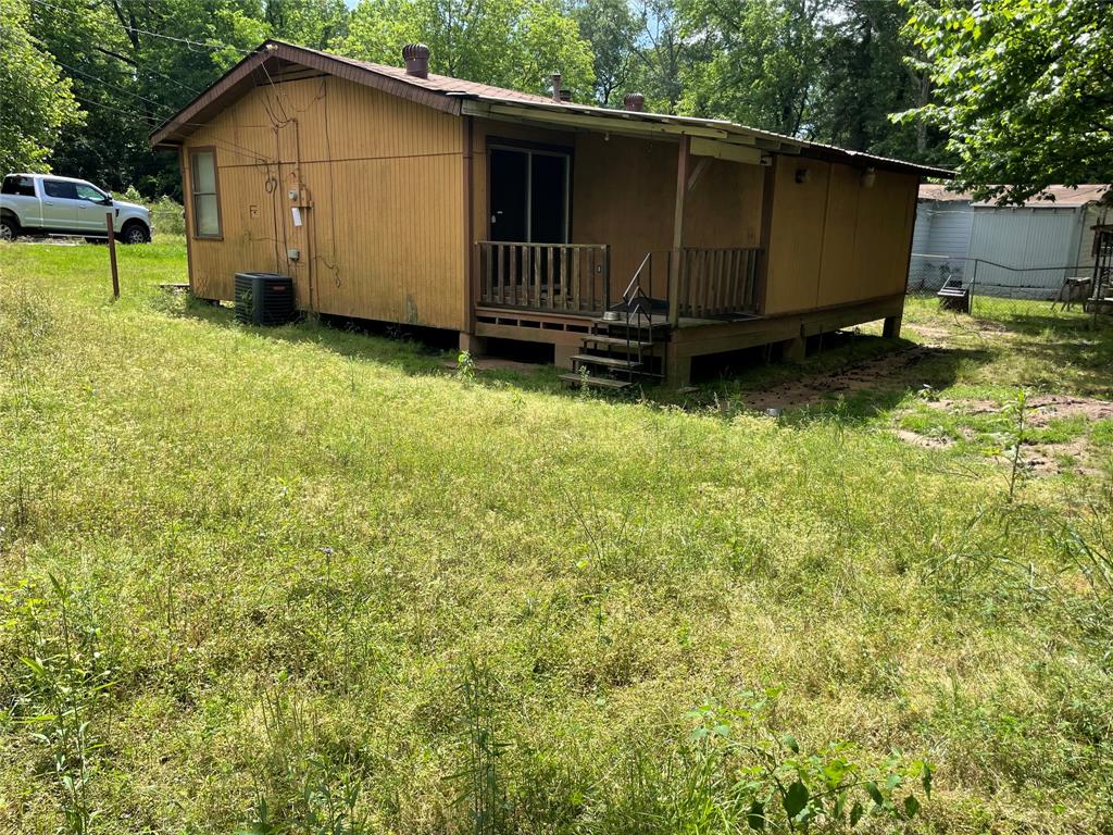 707 Moore Street Minden, LA 71055 - Photo 3 of 6 a view of a backyard with a small cabin