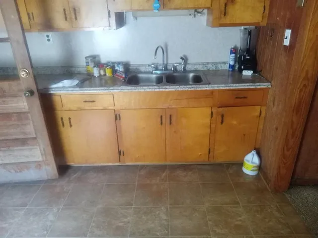 a kitchen with cabinets and appliances