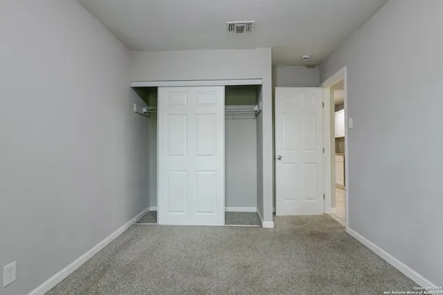 an empty room with closet