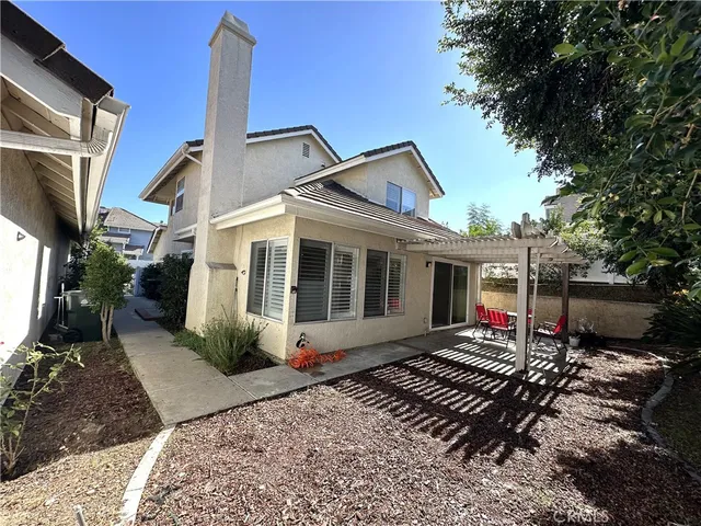 a front view of a house with many windows