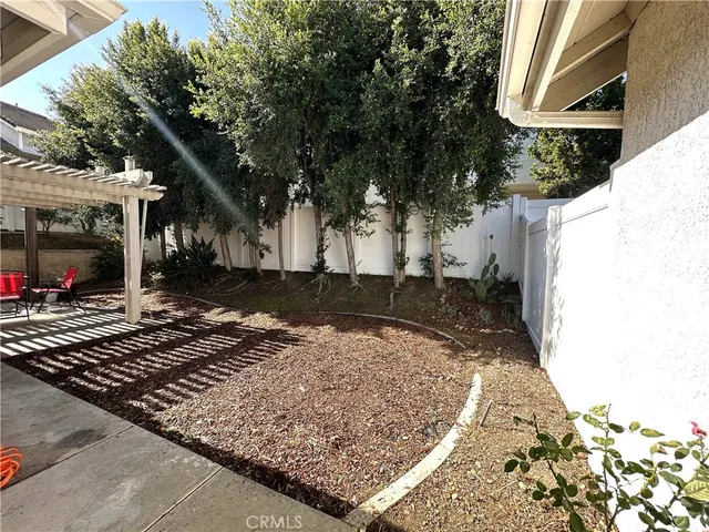 a view of a backyard of the house