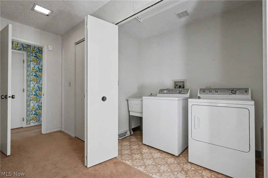 624 Hampton Ridge Drive Akron, OH 44313 - Photo 30 of 46 2nd floor laundry, with bi-fold doors, looking into master bedroom on the left.