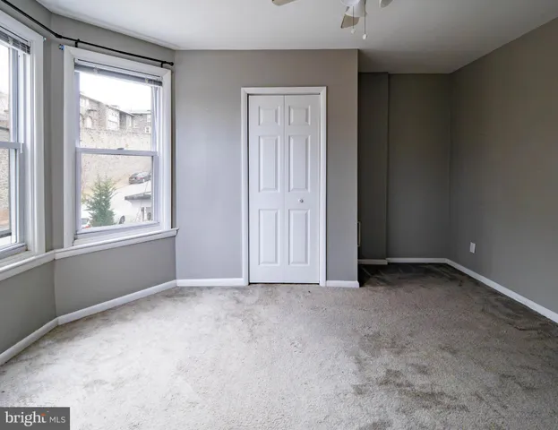 an empty room with windows