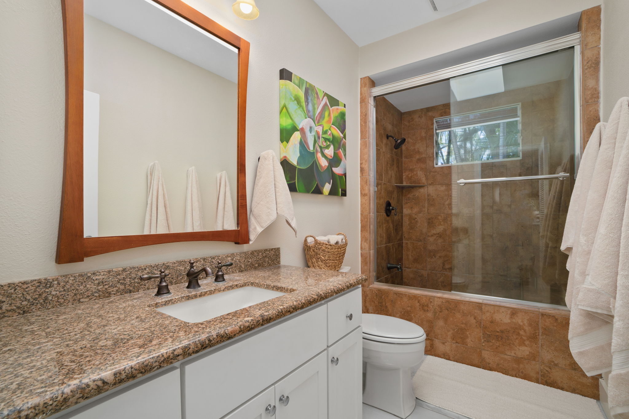 1753 Kelaukia Street Koloa, HI 96756 - Photo 21 of 27 a bathroom with a granite countertop sink toilet and shower