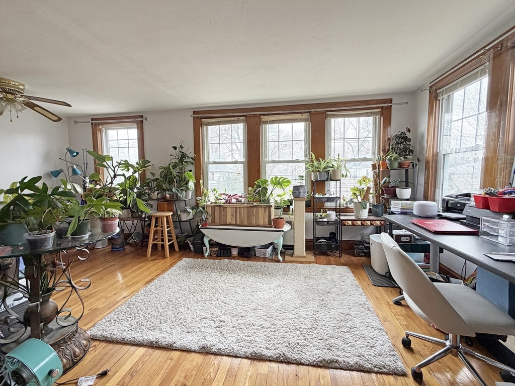 75-77 Dale Street, Unit 77 Waltham, MA 02451 - Photo 3 of 17 a living room filled with furniture hardwood and a window