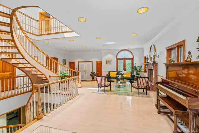 a kitchen with stainless steel appliances granite countertop a stove a sink a refrigerator and a dining table