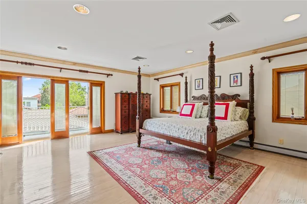 a bedroom with furniture and a window