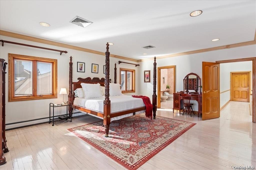 6 Summit Place Queens, NY 11357 - Photo 16 of 35 Bedroom with light hardwood / wood-style flooring, ornamental molding, and baseboard heating