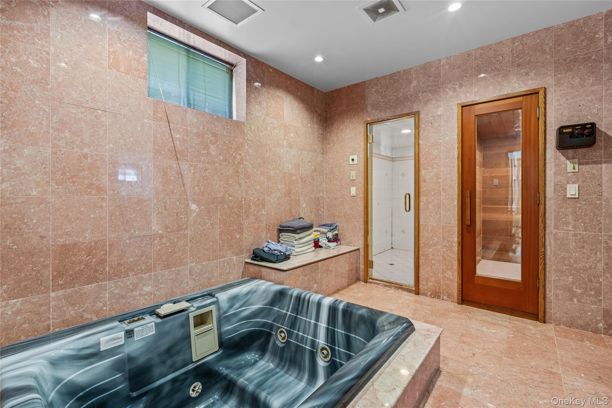 6 Summit Place Queens, NY 11357 - Photo 23 of 35 Full bath featuring tile walls, a tub with jets, a sauna / steam room, and recessed lighting
