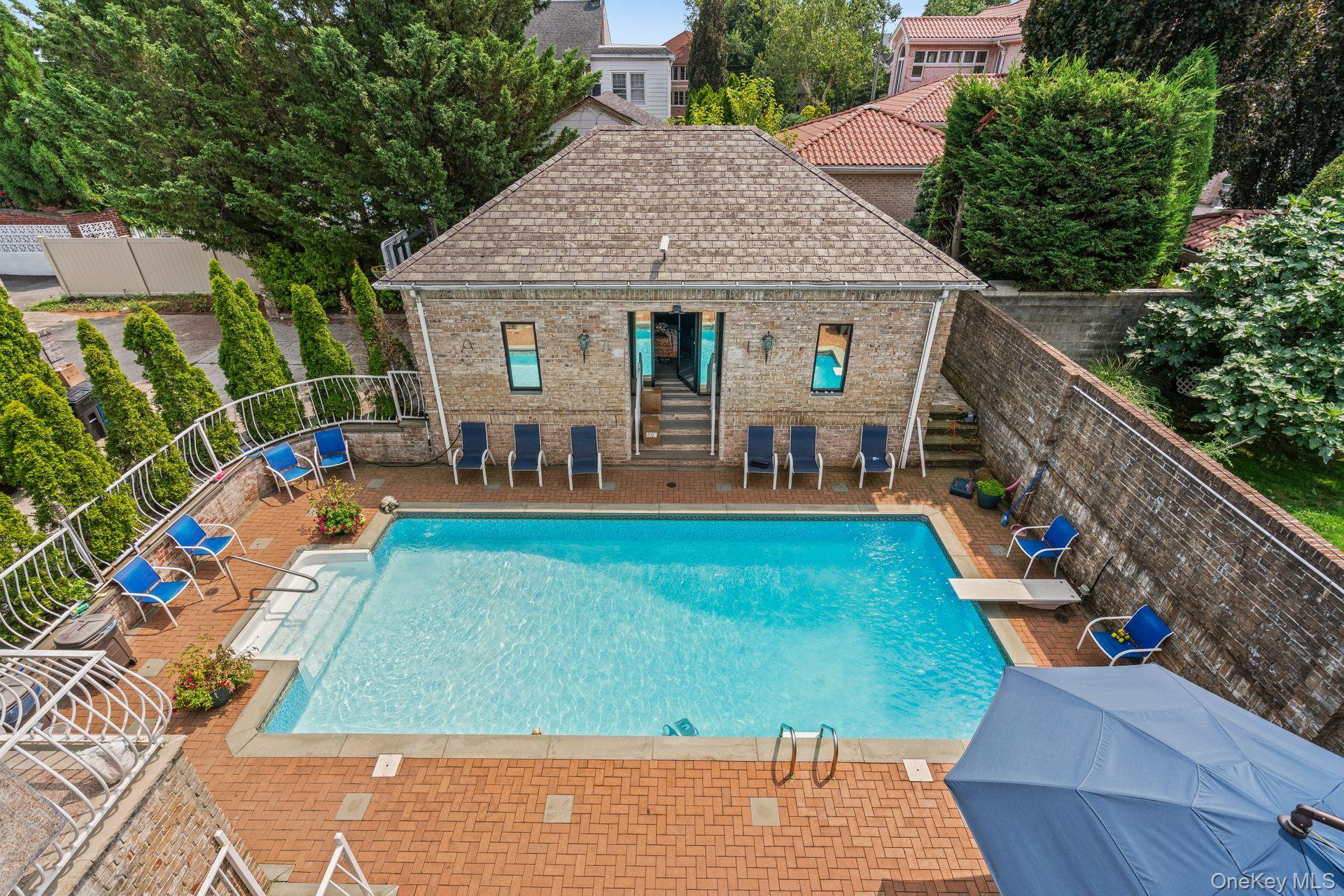 6 Summit Place Queens, NY 11357 - Photo 26 of 35 swimming pool view with seating space