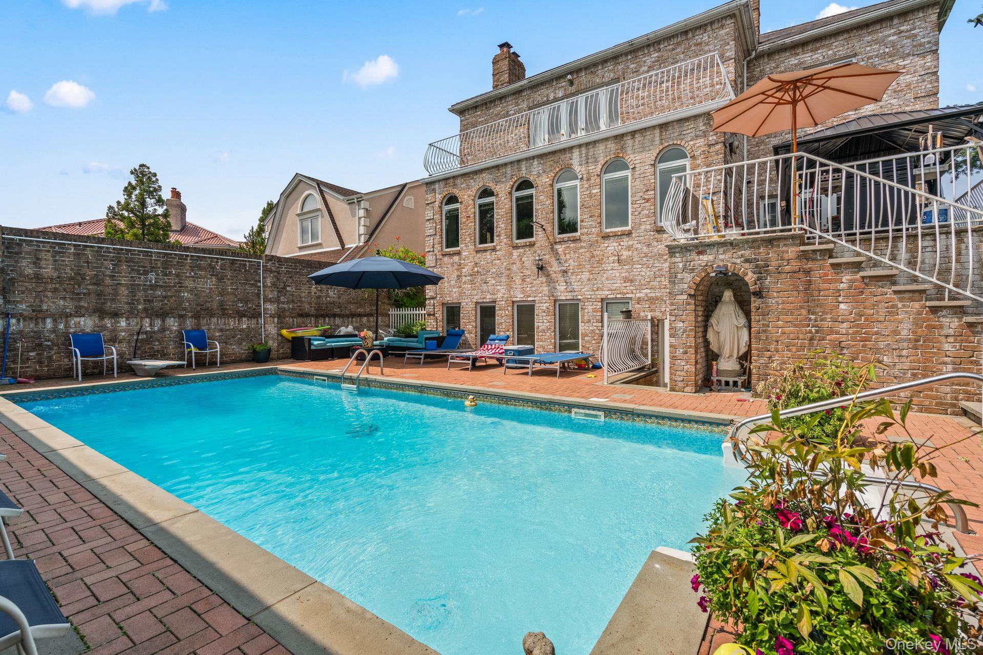 6 Summit Place Queens, NY 11357 - Photo 27 of 35 View of pool featuring a patio area and a diving board