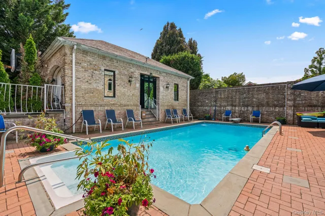 a view of a livingroom with furniture and staircase