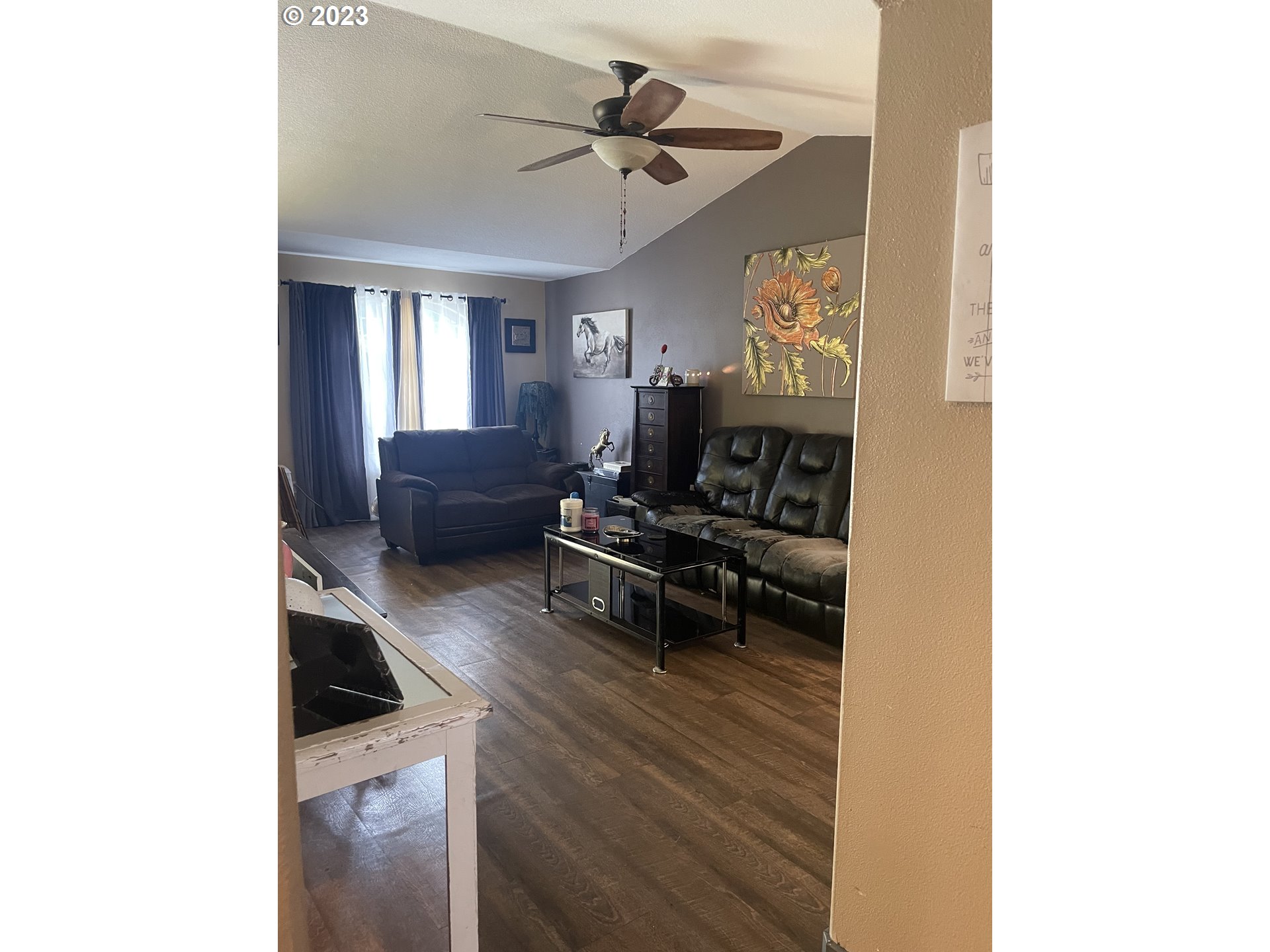 4124 Forsythia Street Springfield, OR 97478 - Photo 3 of 12 a living room with furniture and a chandelier