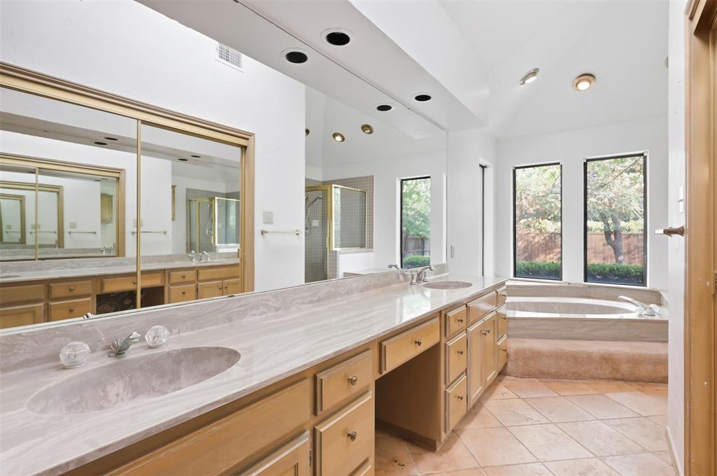 37 Timbergreen Circle Denton, TX 76205 - Photo 26 of 31 Double vanity with integrated sinks, recessed lighting, large soaking tub, and floor-to-ceiling windows