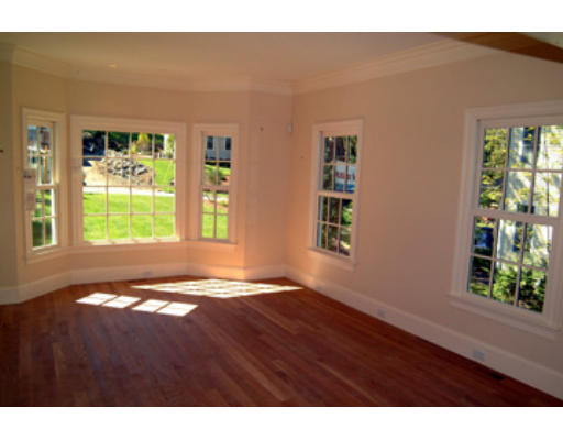 56 Wareland Road Wellesley, MA 02481 - Photo 3 of 11 a view of an empty room with window and wooden floor