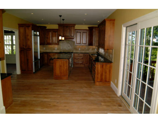 56 Wareland Road Wellesley, MA 02481 - Photo 5 of 11 a kitchen with kitchen island granite countertop wooden cabinets and a granite counter tops