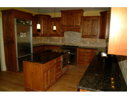 56 Wareland Road Wellesley, MA 02481 - Photo 6 of 11 a kitchen with stainless steel appliances granite countertop a stove a sink and a refrigerator