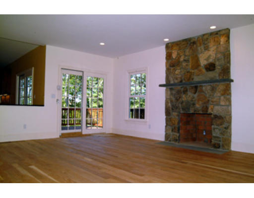 56 Wareland Road Wellesley, MA 02481 - Photo 7 of 11 a view of an empty room with a window and wooden floor
