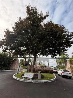 a view of a play ground in front of a house