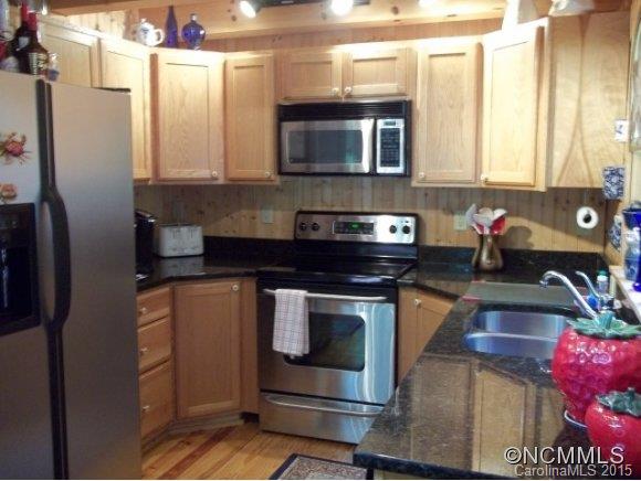 782 Front Ridge Circle Rutherfordton, NC 28139 - Photo 15 of 24 a kitchen with stainless steel appliances granite countertop a stove a sink and a microwave