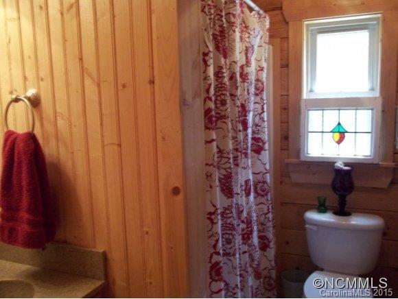 782 Front Ridge Circle Rutherfordton, NC 28139 - Photo 19 of 24 a bathroom with a toilet and shower curtain