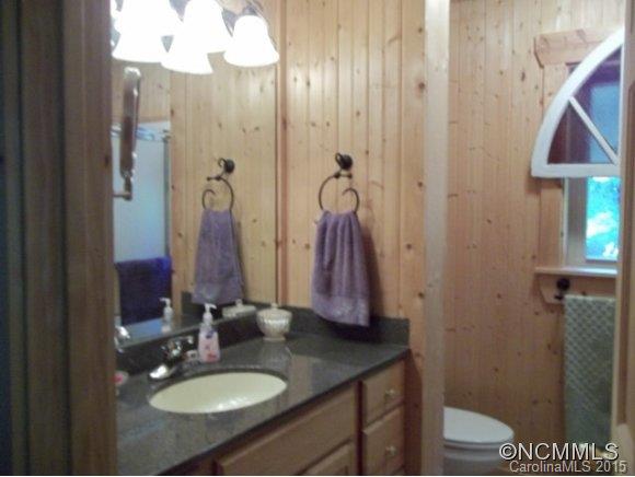 782 Front Ridge Circle Rutherfordton, NC 28139 - Photo 10 of 24 a bathroom with a granite countertop sink a toilet and shower