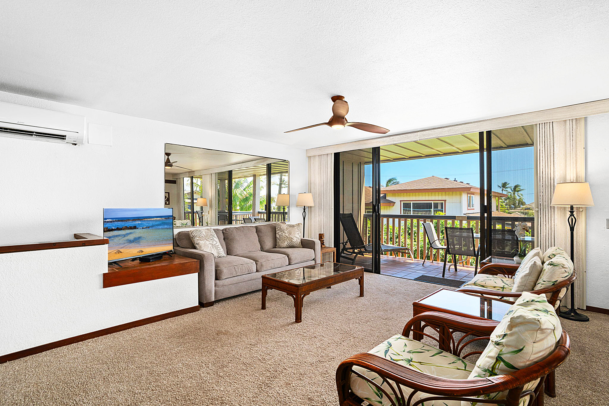 1870 Hoone Road, Unit 511 Koloa, HI 96756 - Photo 11 of 30 a living room with furniture and a large window