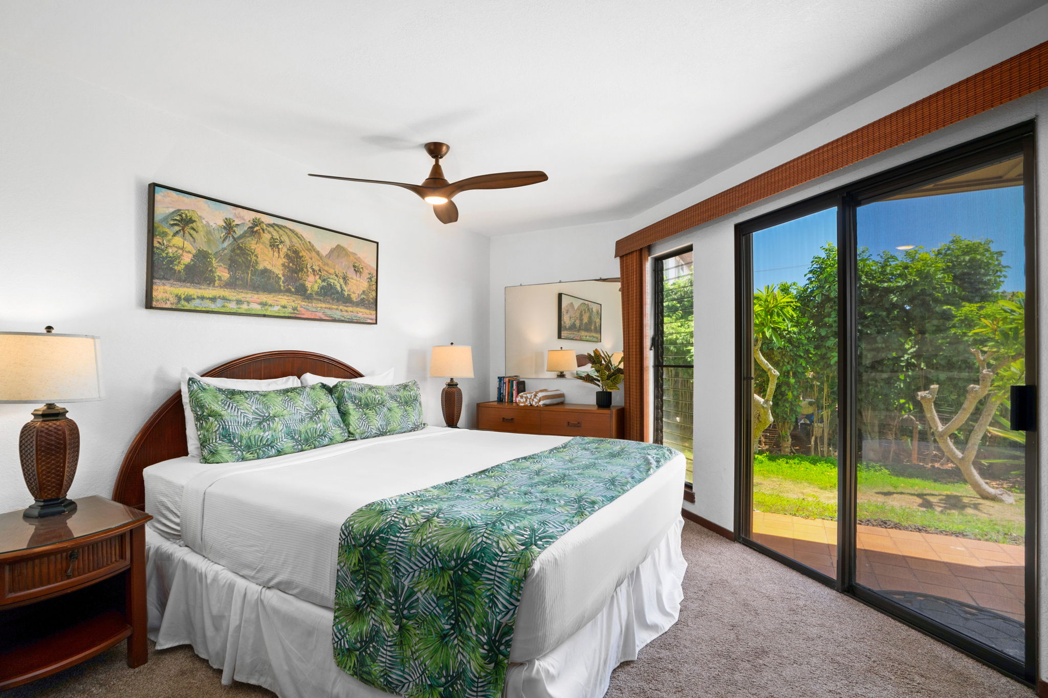 1870 Hoone Road, Unit 511 Koloa, HI 96756 - Photo 18 of 30 a bedroom with a large bed and a large window