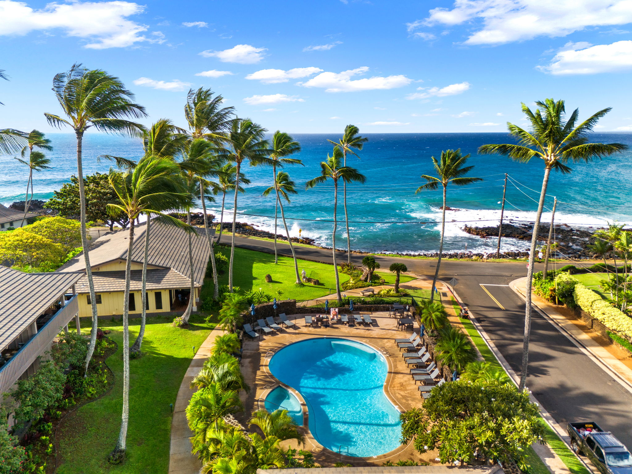 1870 Hoone Road, Unit 511 Koloa, HI 96756 - Photo 2 of 30 a view of a swimming pool with a patio