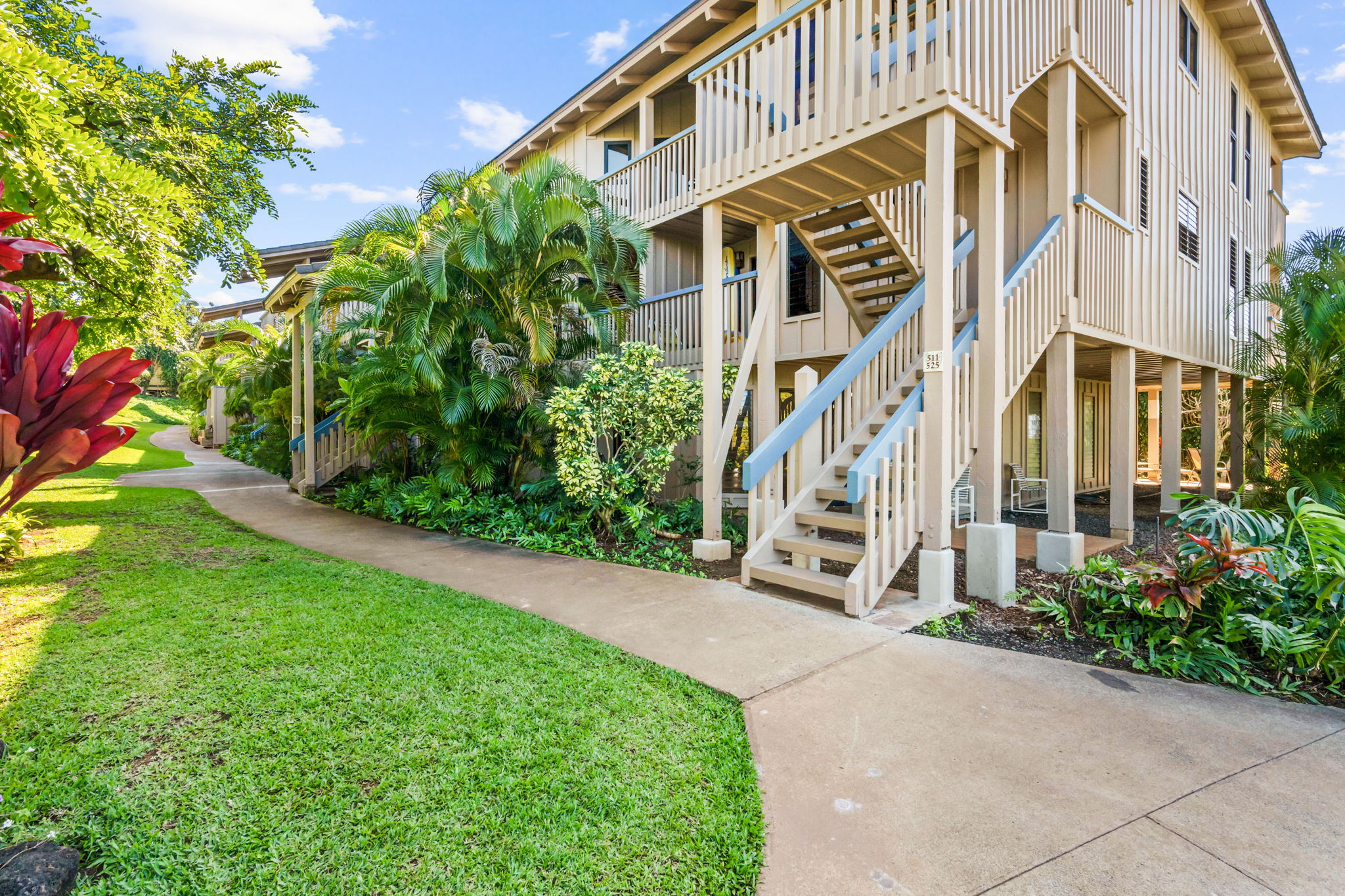 1870 Hoone Road, Unit 511 Koloa, HI 96756 - Photo 24 of 30 a view of a building with a yard
