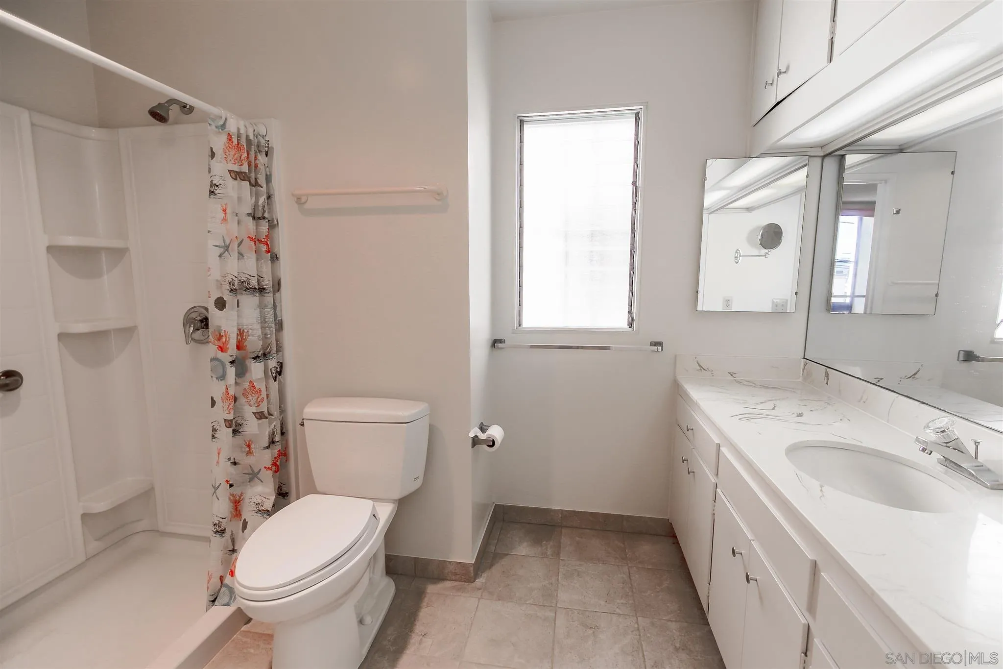 7434 High Avenue La Jolla, CA 92037 - Photo 11 of 15 a bathroom with a sink a toilet and shower