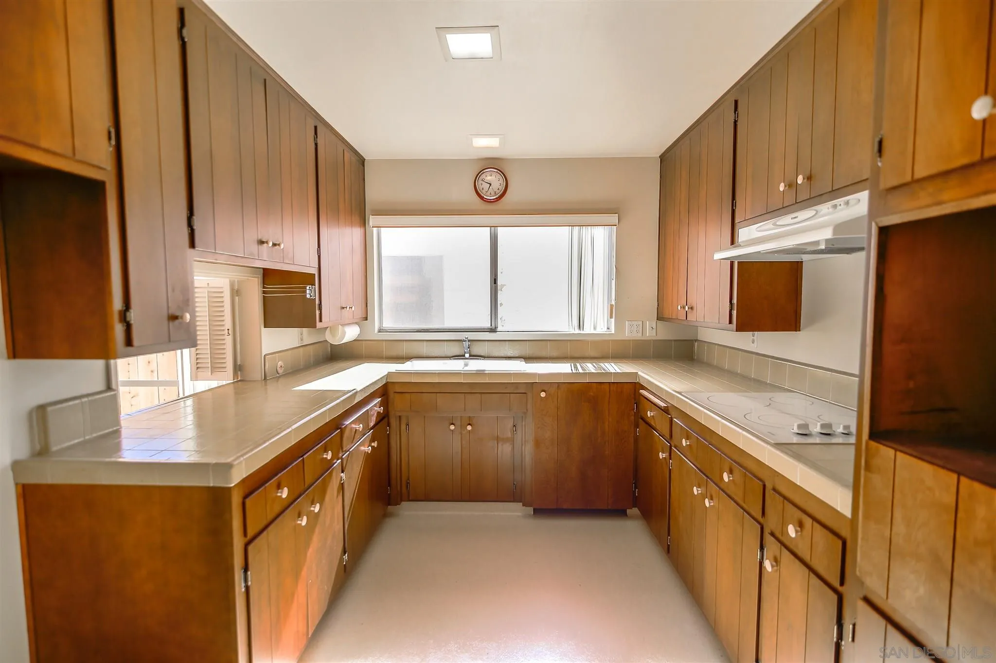 7434 High Avenue La Jolla, CA 92037 - Photo 5 of 15 a kitchen with stainless steel appliances granite countertop a sink stove and refrigerator
